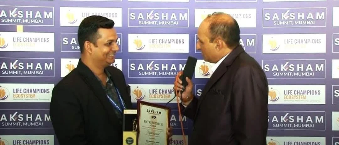Director Rajat Agrawal receiving an award on stage